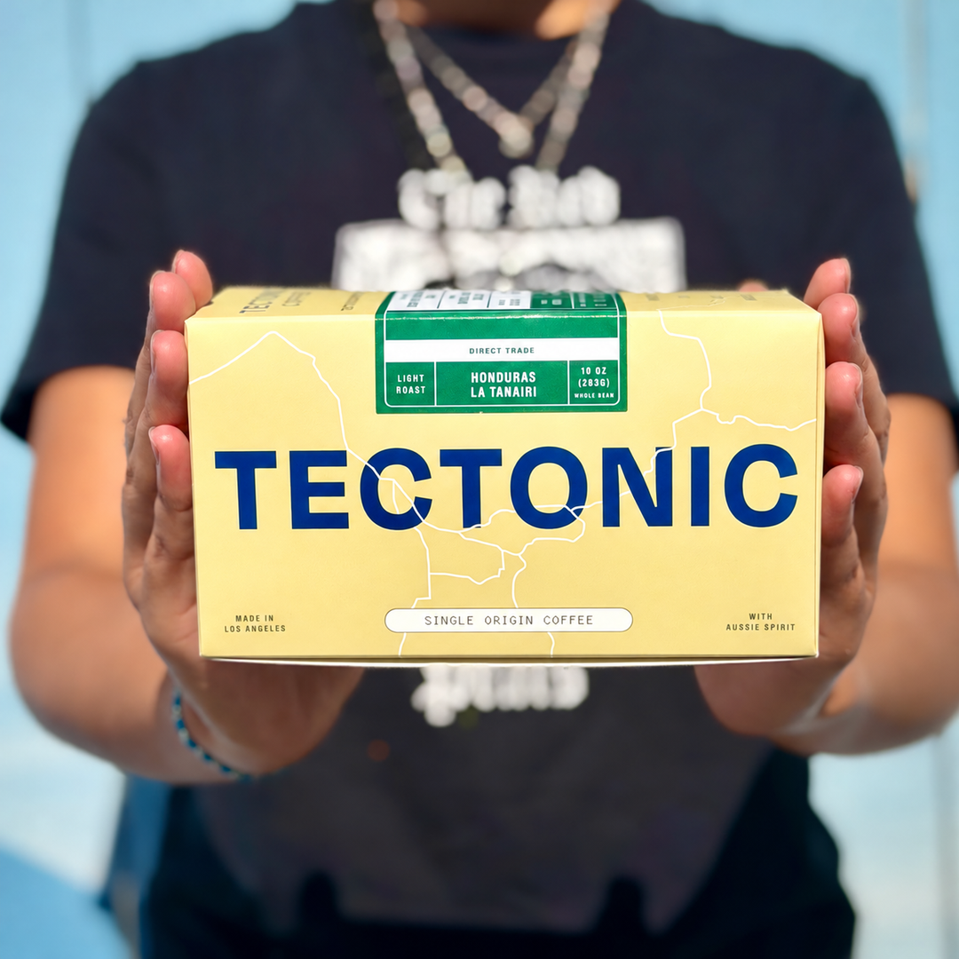 Person holding Tectonic Honduras La Tanairi Natural coffee, 10 oz (283 g).
