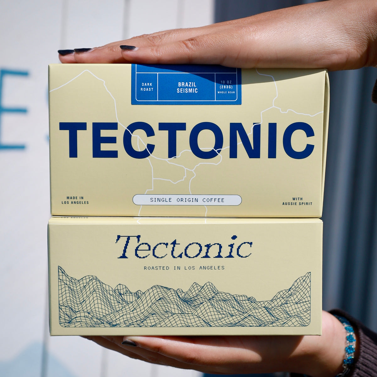 Tectonic Coffee Seismic Brazil dark roast 10oz packaging, alternate view; whole bean packaging shown.