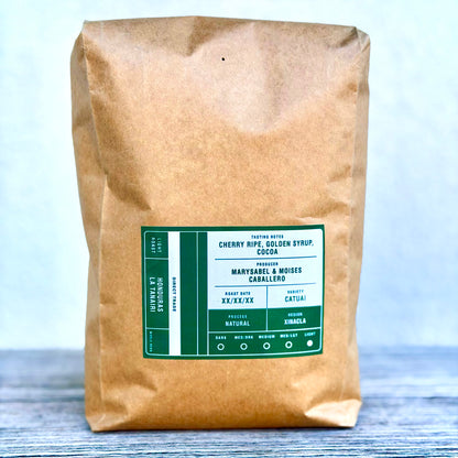 1 kg bag of Tectonic Honduras La Tanairi Natural whole-bean coffee on a tabletop.